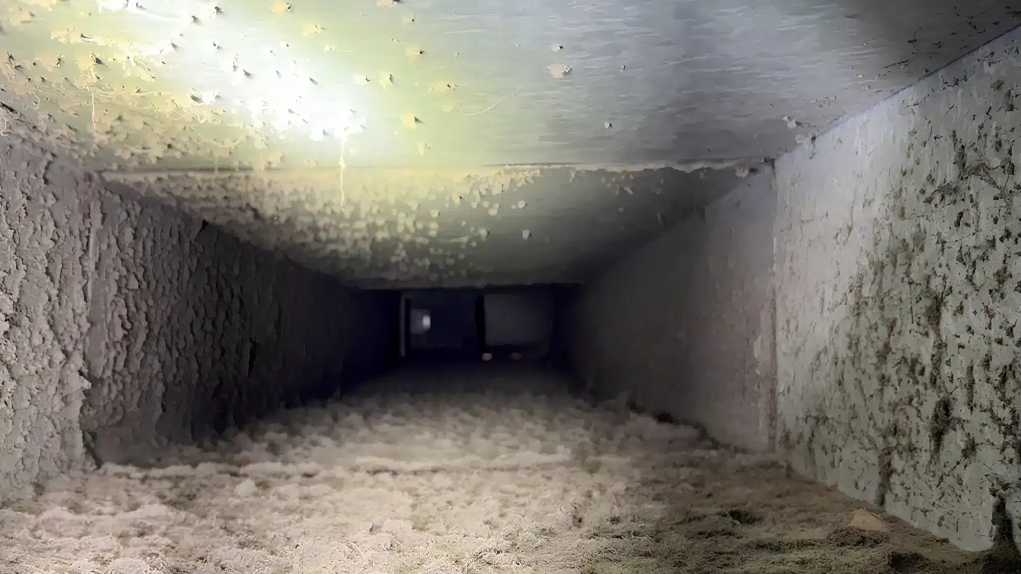 Dust buildup around an air vent showing signs of dirty air ducts affecting home comfort